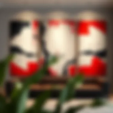 Close-up of a red, black, and white triptych wall art