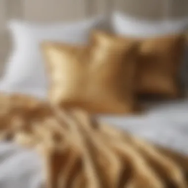 Stylish arrangement of cushions on white and gold bedding