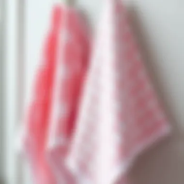Close-up of pink kitchen towels featuring intricate patterns