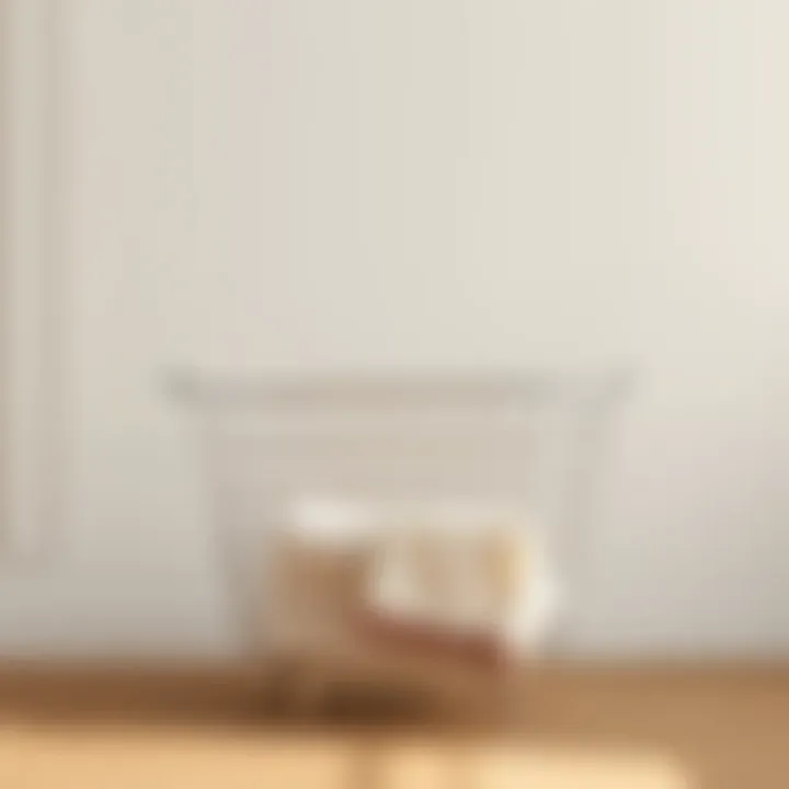 Sleek Metal Laundry Basket Sleek metal laundry basket against a minimalist backdrop